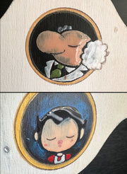 Close up of 2 painted details on the plaque, each characters from Astroboy.