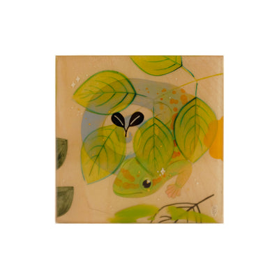 Small painting on exposed wooden panel of a gecko, blue and green, wrapped around itself behind semi transparent leaves. 