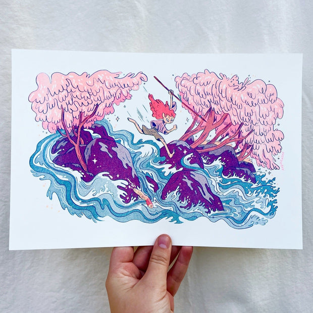 Risograph print in mostly pink, purple and blue of a small girl with long pink hair running atop of a rushing river among purple rocks. She holds a spear and looks down towards a fish which jumps out of the water. 