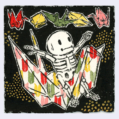 Ink and watercolor illustration of a cartoon skeleton riding a patterned paper crane, against a black background with gold dots and other origami overhead.