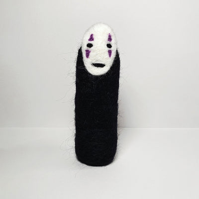 Needle felt wool sculpture of No Face from Spirited Away, standing without any visible limbs (arms or legs).