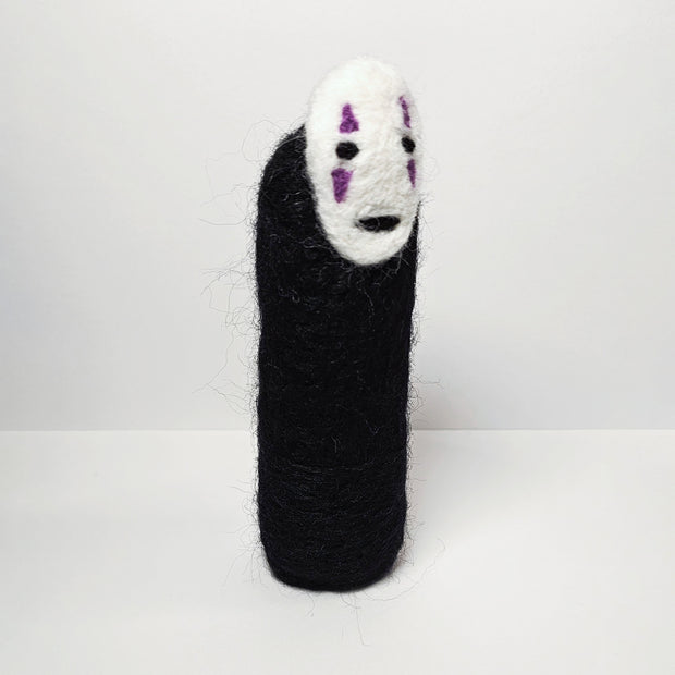 Needle felt wool sculpture of No Face from Spirited Away, standing without any visible limbs (arms or legs).