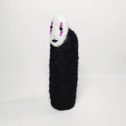 Needle felt wool sculpture of No Face from Spirited Away, standing without any visible limbs (arms or legs).