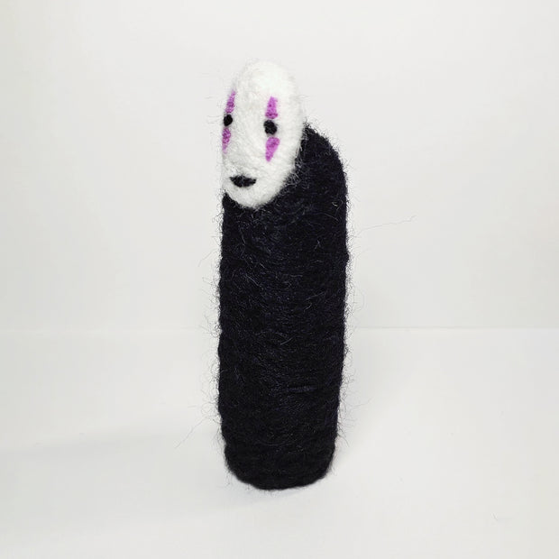 Needle felt wool sculpture of No Face from Spirited Away, standing without any visible limbs (arms or legs).