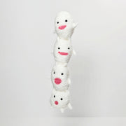 Needle felted sculpture of a stack of 4 cute, simplistic white blob characters with tiny limbs and pink mouthed smiles. They stand in various poses.