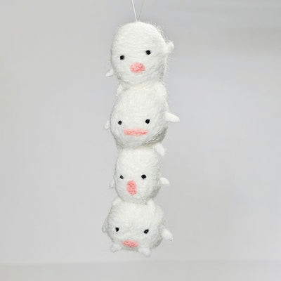 Needle felted sculpture of a stack of 4 cute, simplistic white blob characters with tiny limbs and pink mouthed smiles. They stand in various poses.