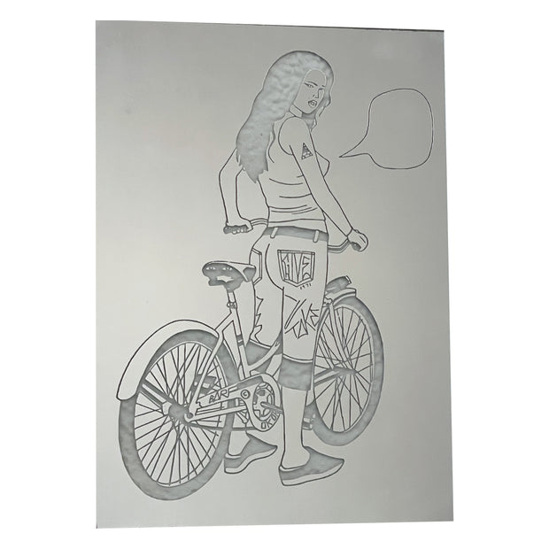 Stencil cut out of a mirrored surface of a girl standing over a bike, as if pausing from riding. She looks back over her shoulder and has an empty speech bubble.