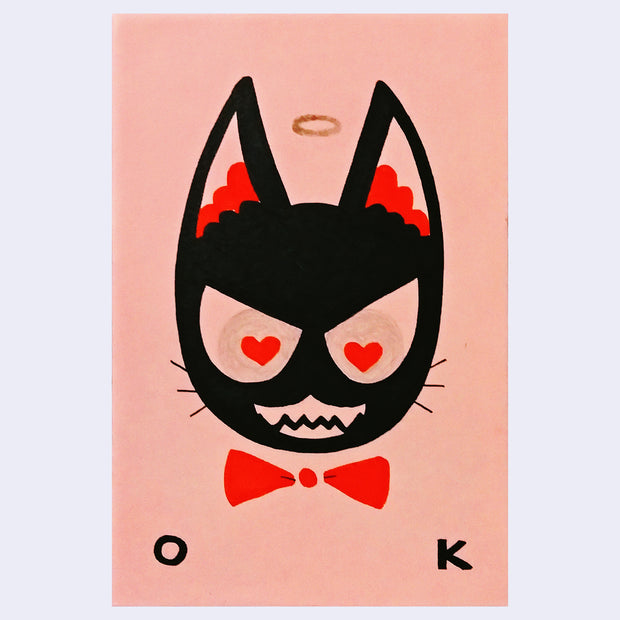 Block color illustration of a black cat head with a red bowtie and angry expression with heart shaped pupils. A small halo floats overhead with text below that reads "O K"