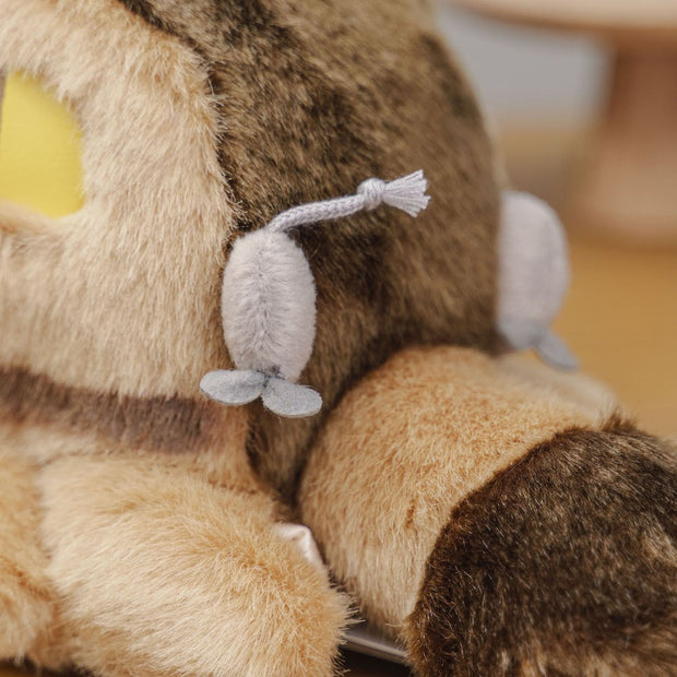 Fluffy large plush of Catbus, laying on its stomach with attached elements such as mice as tail lights and 3D eyes, nose, whiskers.