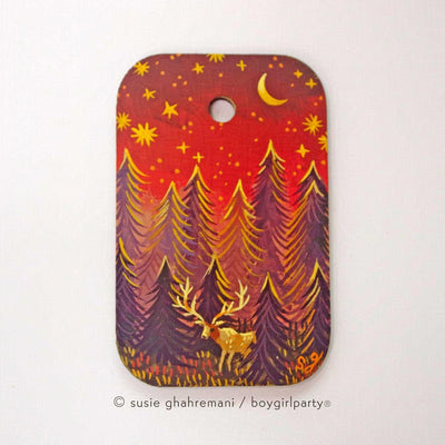 Painting of a forest with tall purple trees at a bright red sunset. A small stag with very large antlers stands in the forest.