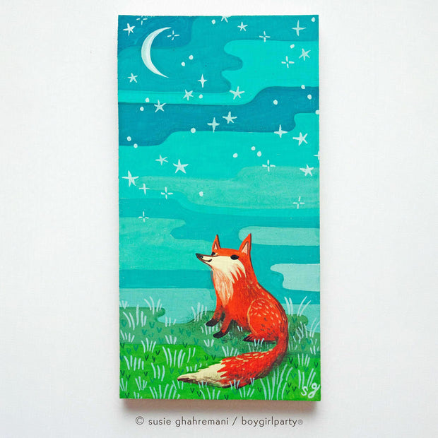 Painting of a cartoon red fox smiling and sitting on grass, looking up at a crescent moon and greenish blue sky.