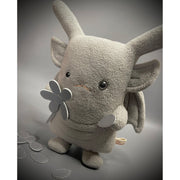 Plush doll of a bunny with skinny ears and a flat body, made to look like a gargoyle. It holds a pleather flower and plucks a petal from it.