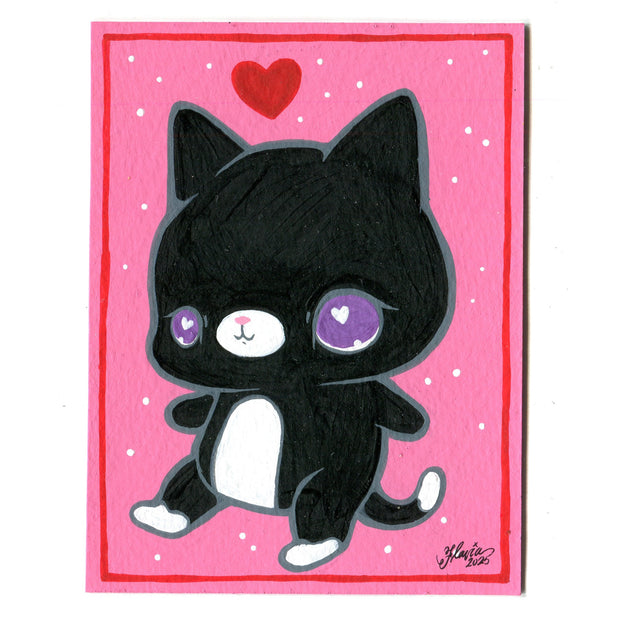 Painting of a black cartoon cat with a large head and cute purple eyes. It stands on 2 legs like a person and has a red heart over its head. Background is pink with white dots and a red line border.