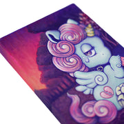 Painting of a small, cute blue cartoon unicorn sitting on the ground with a bandaged leg. It has a pink curly mane and a sparkly horn. Background is a red and purple dark sunset.