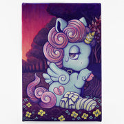 Painting of a small, cute blue cartoon unicorn sitting on the ground with a bandaged leg. It has a pink curly mane and a sparkly horn. Background is a red and purple dark sunset.