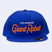 Flat billed cap, bright blue with white and orange stylized letters that say "Los Angeles Giant Robot" across the front.