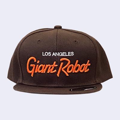 Flat billed cap, dark brown with white and orange stylized letters that say "Los Angeles Giant Robot" across the front.