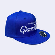 Flat billed cap, bright blue with white stylized letters that say "Los Angeles Giant Robot" across the front.