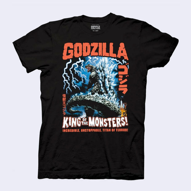 Black t-shirt with a graphic on it of Godzilla, standing tall with his large tail behind him and lightning striking down. Text above reads "Godzilla" and below "King of the Monsters!"