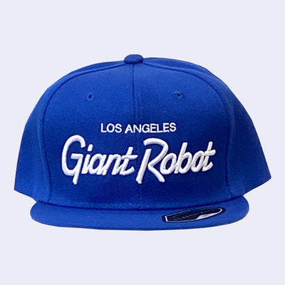 Flat billed cap, bright blue with white stylized letters that say "Los Angeles Giant Robot" across the front.