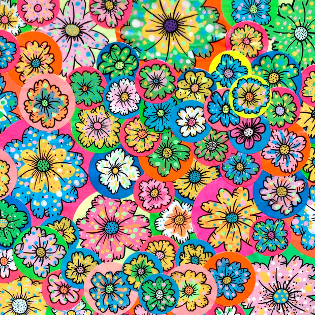 Colorful collage style painting of many brightly colored flowers on round stickers all pasted atop one another.