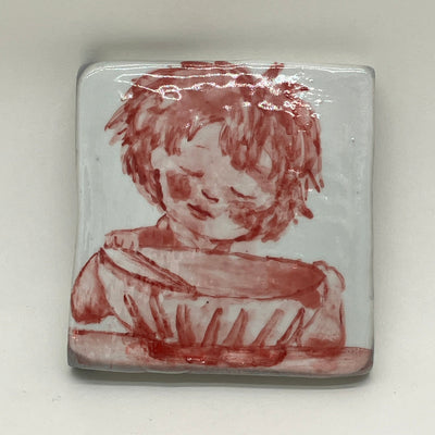 Ceramic tile with red illustration of a little girl with closed eye leaning over a large bowl with chopsticks.