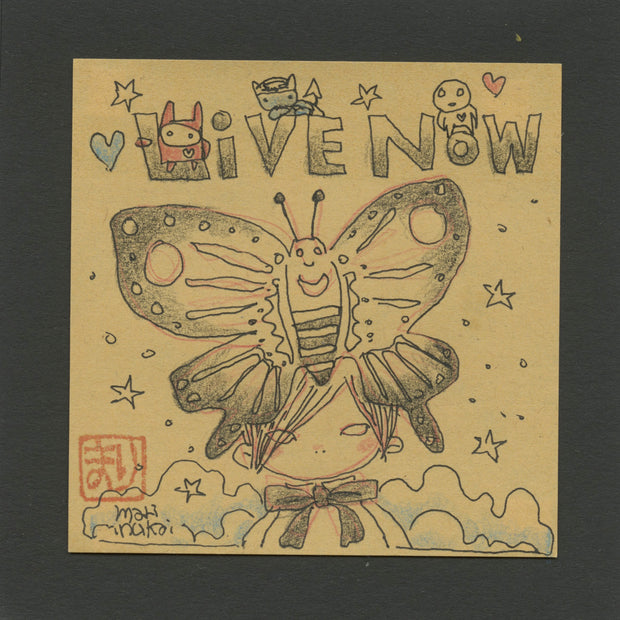 Illustration on a tan sticky note of a girl with a large butterfly atop her head, covering all of her hair aside from her bangs. Text overhead says "Live now"