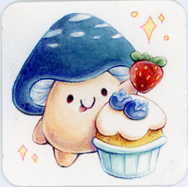 Small colored pencil illustration of a cartoon mushroom with a blue top and a cute, tongue out facial expression. It holds up a strawberry over a blueberry cupcake.