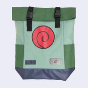 Green roll top canvas backpack with a large red Uzumaki logo on the front and a small metal plaque with the insignia of the Hidden Leaf VIllage from Naruto. It has side pockets and bucket straps up top.