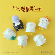 6 different vinyl figures within the same theme: 5 are cartoonish ghosts with yellow boots doing various activities such as sitting, painting, throwing up, etc. Final figure is a purple character with a pompadour and school wear.