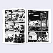 Open 2 page spread of black and white comic, with various panels and spreads.