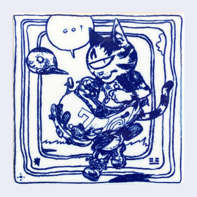 White ceramic square tile with a deep blue line art illustration of a cartoon cat wearing a small car around its body, with a speech bubble that reads "go?". A bird head floats nearby and several lines border the tile.