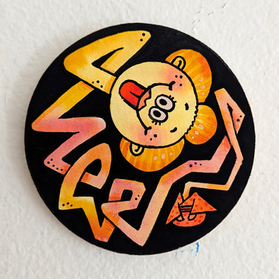 Painting on circular panel of a orange and red long line coming from a tiny kimono wearing body. The end of the line is a smiley face with the tongue out and a geisha's wig.