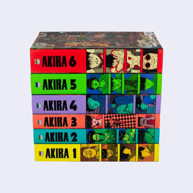 Stack of all 6 volumes of Akira, hardcover versions with bright colored spines with the appropriate numbers.