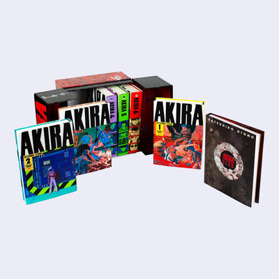 Open view of the complete Akira Box Set, with 6 hardcover volumes of Akira and a bonus book titled "Akira Club".