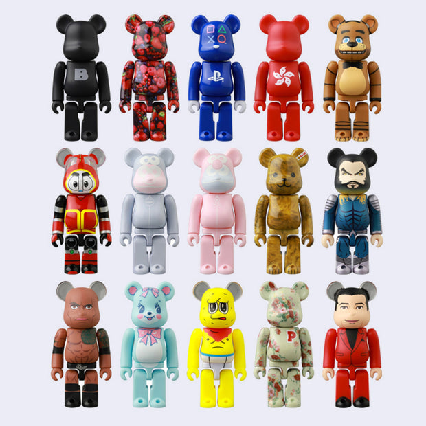 13 vinyl bear figures with blocky body parts, like an action figure. They all have different coloring/paint jobs.