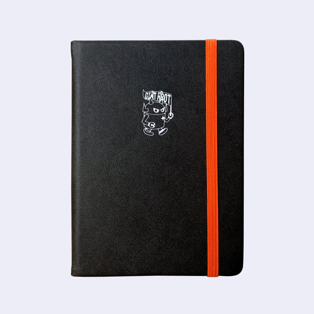 Black pleather covered sketchbook with a small embossment of a robot carrying a flag that reads "Giant Robot" in the upper center. A bright orange elastic band keeps the sketchbook closed.