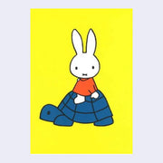 Yellow background postcard featuring an illustration of Miffy wearing an orange dress and sitting atop of a blue tortoise. 