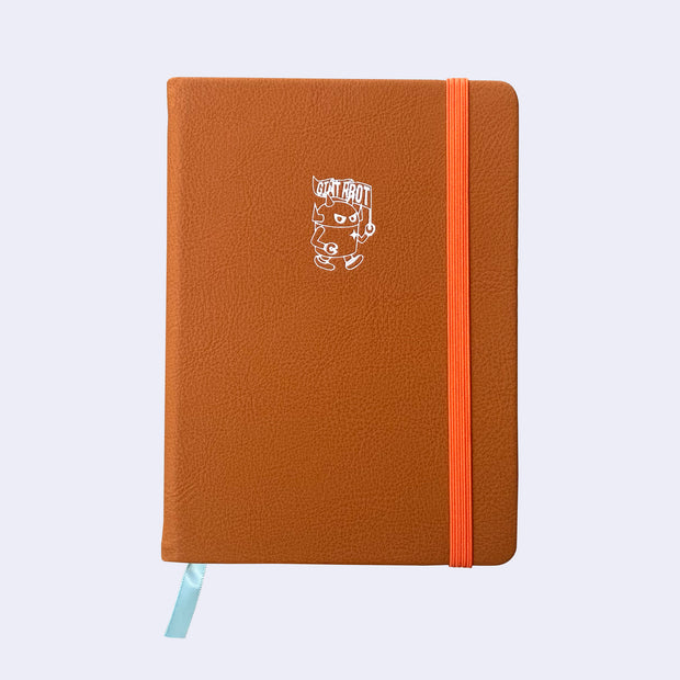 Orangish brown colored pleather covered sketchbook with a small embossment of a robot carrying a flag that reads "Giant Robot" in the upper center. A bright orange elastic band keeps the sketchbook closed.