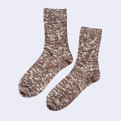 Cotton crew socks thickly knit with a dark but warm brown and white thread. Each color is mixed.