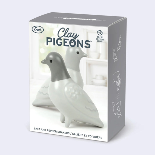 Product packaging for Clay Pigeons, a set of 2 gray matte ceramic salt and pepper shakers shaped like pigeons.