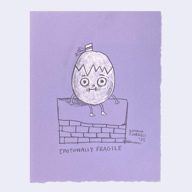 Drawing on purple paper of an egg sitting on the wall with text that reads "emotionally fragile"