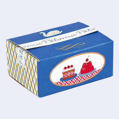 Small cardboard box made to look like a pastry package from a nice French Patisserie, with elegant blue coloring and illustrations of pretty desserts on the side. 