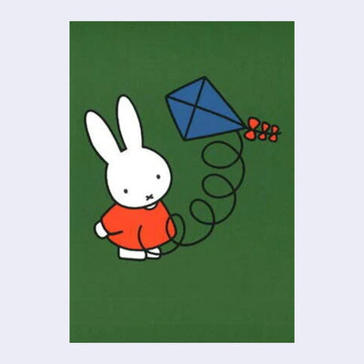 Green background postcard with an illustration of Miffy with a blue kite flying nearby her.