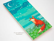 Painting of a cartoon red fox smiling and sitting on grass, looking up at a crescent moon and greenish blue sky.