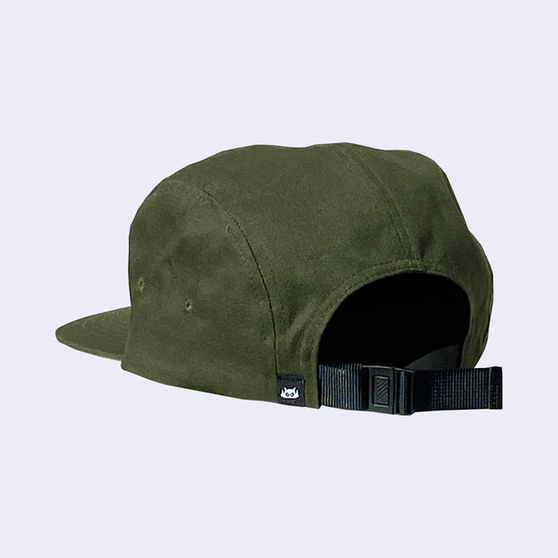 Back view of a dark green 5 panel hat with an adjustable black strap and a small embroidered detail of a Big Boss Robot head on the back side.