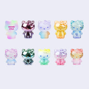 10 different designs of colorful transparent or metallic figurines of Hello Kitty, wearing a special hair bow that reads "50" with the 0 being a heart. 