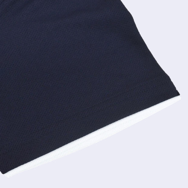 Sleeve detail, navy blue jersey material with a white lining.