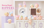 Front view of all 12 options from Sonny Angel Dreaming Hippers series blind box. Each figure is of a Kewpie baby resting its head in its hands and sleeping while smiling. They each have a pastel colored hood hat of an animal.