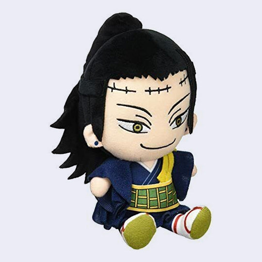 Small plush of Suguru Geto from JJK with a large head and a snarky smile. He has scars on his forehead and wears a nice robe.